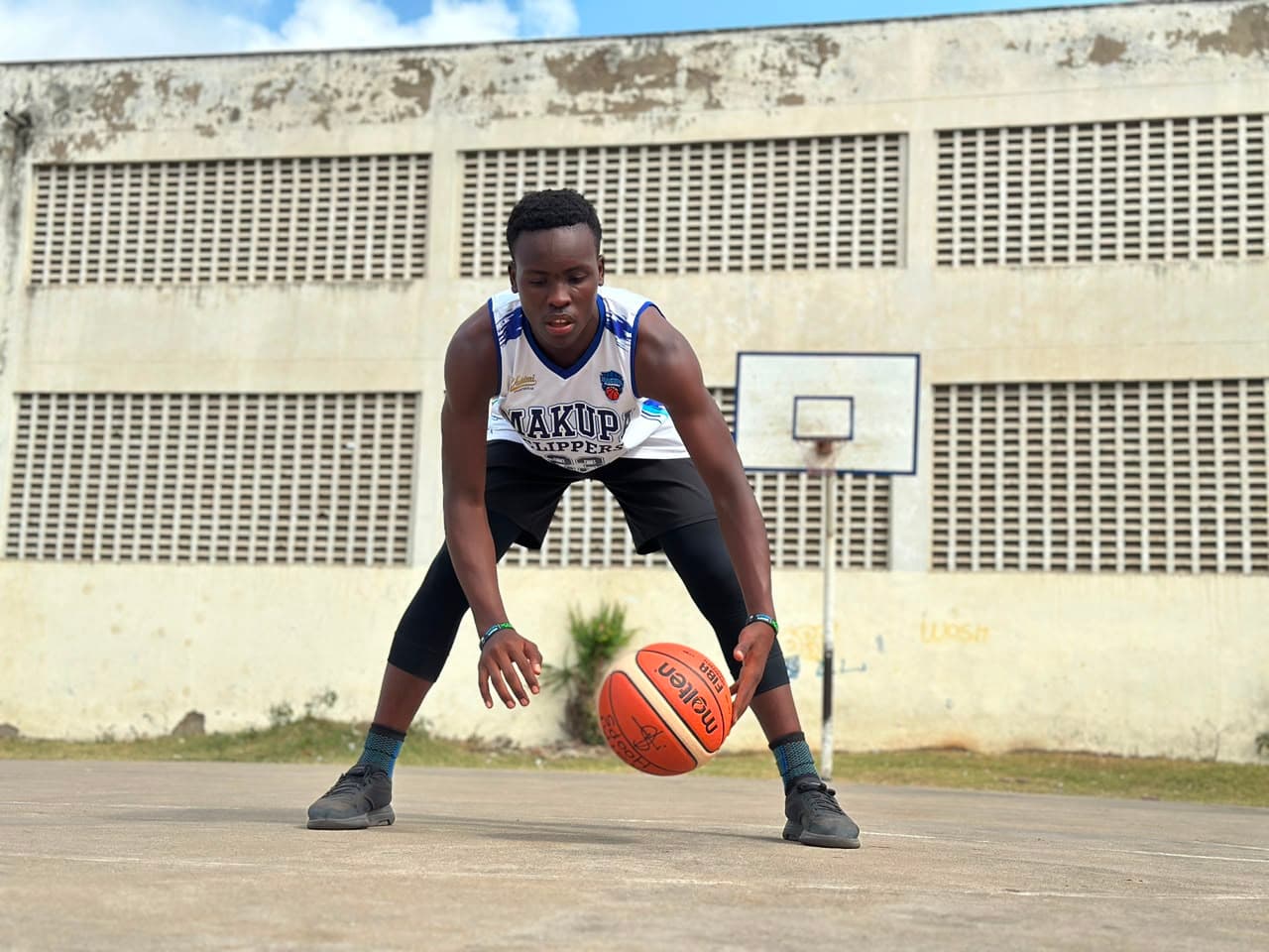 Makupa Clippers featured player handling the basketball